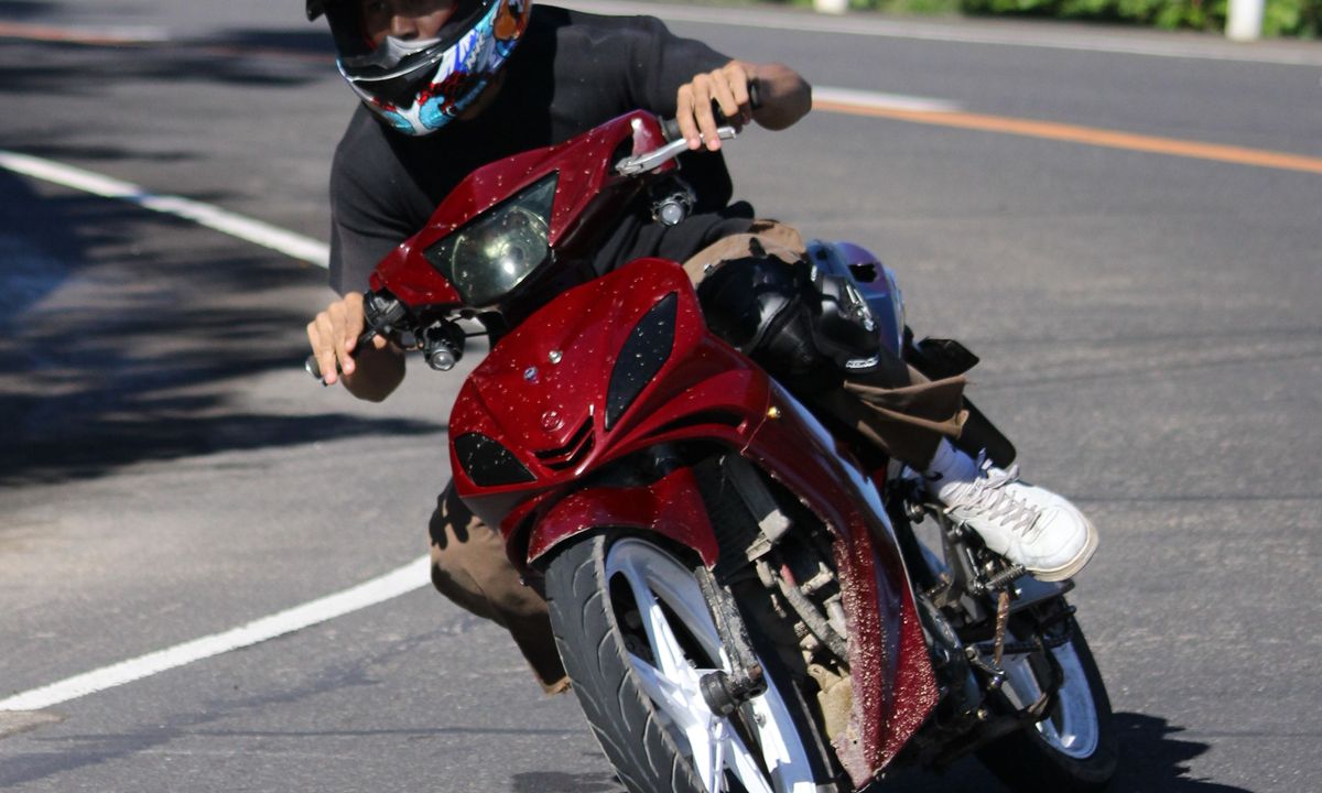 Rider with a helmet on a road in Vietnam